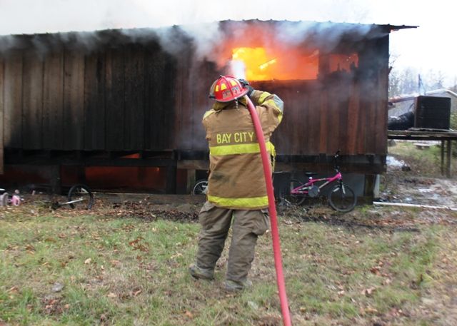 Firefighters battle blaze & bullets, teen injured by exploding propane ...