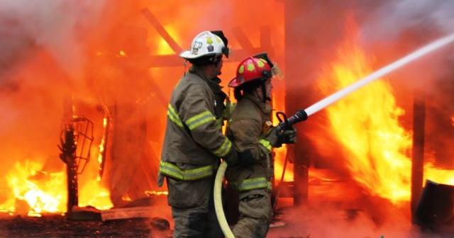 Firefighters battle blaze & bullets, teen injured by exploding propane ...