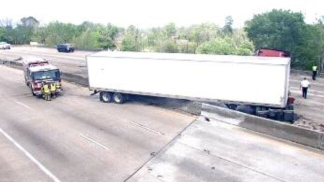 Woman killed after crashing head on into jackknifed 18 wheeler in