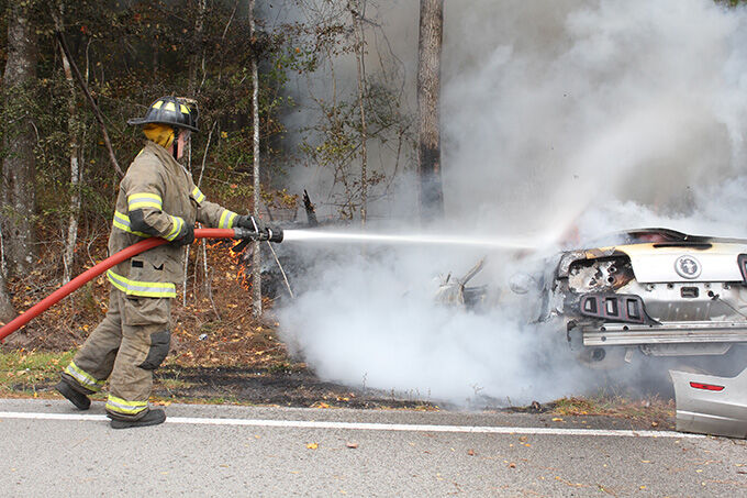 Driver escaped injury when car left the highway, hit a tree, and burst ...