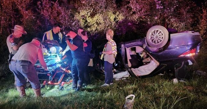 Driver trapped upside-down with severe leg injury after crash near ...