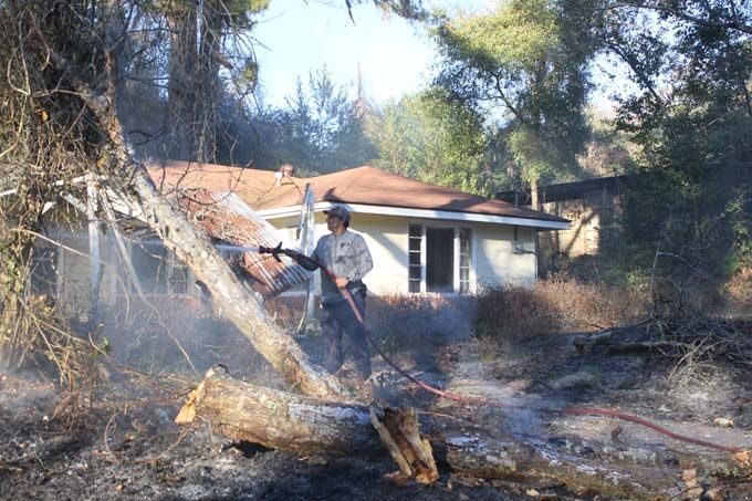 Power line falls on Avenue A, setting fire to the front yard of a home ...