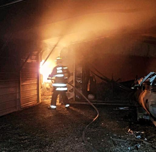 Hickory County firefighters battle fire that engulfs garage, camper ...