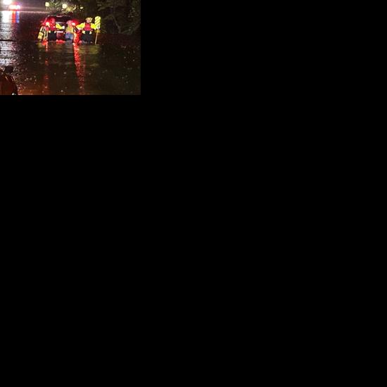 Two sets of motorists rescued early this morning from flood waters near Columbia