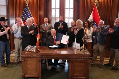 Governor Mike Parson signs bills enacting income tax cuts, agricultural tax credit plan
