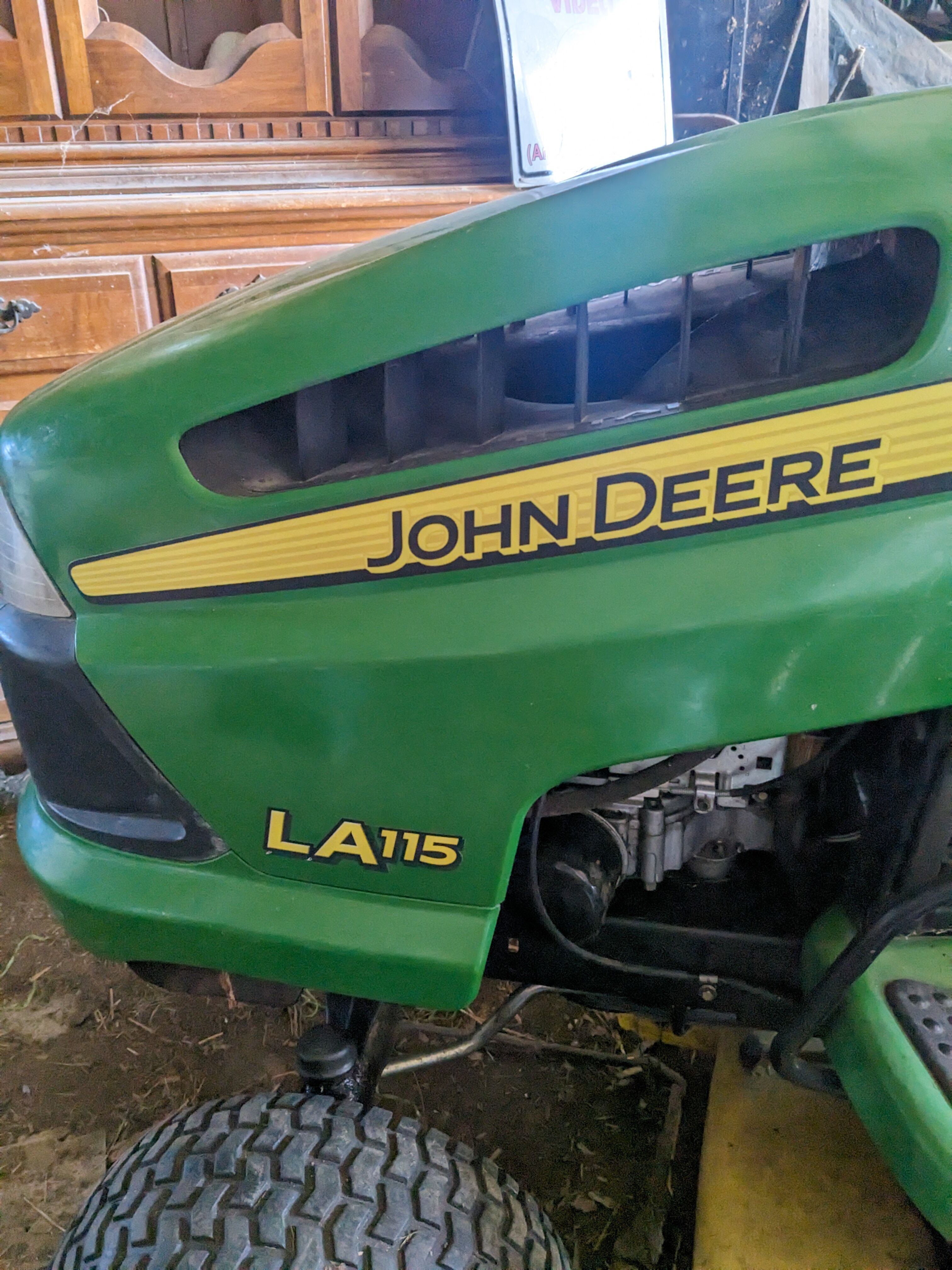 John Deere LA 115 riding lawn mower with tiller attachment