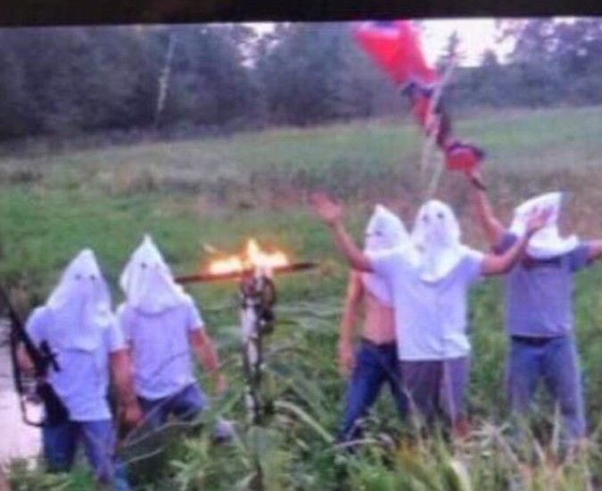 Students disciplined for photo in white hoods with Confederate flag, burning cross