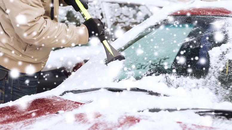 Winter Storm scraping snow off car - 16:9