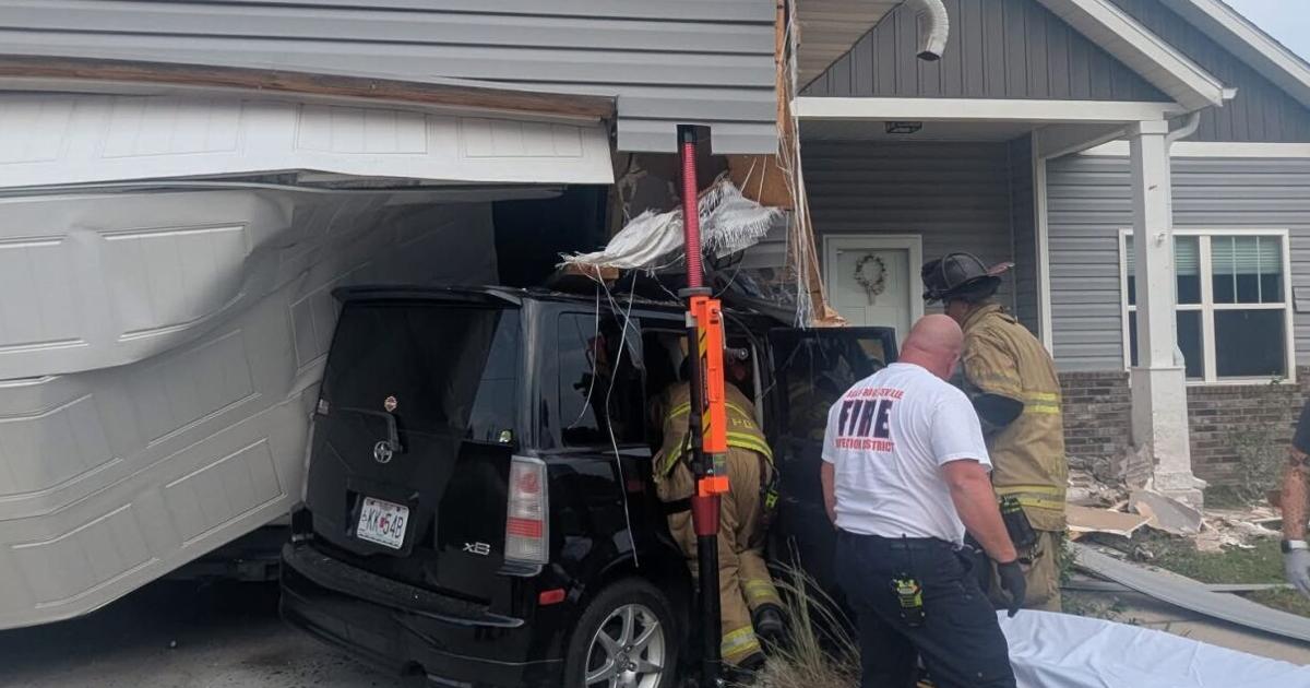 Vehicle crashes into house, two injured near Springfield