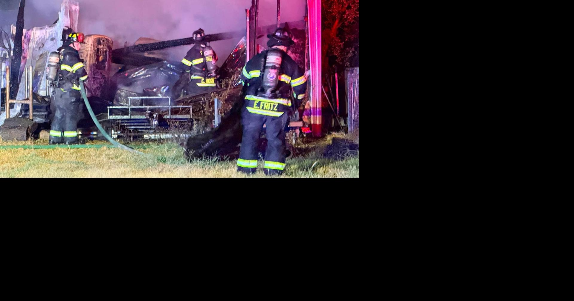Multiple fire crews battle a garage fire; No injuries reported