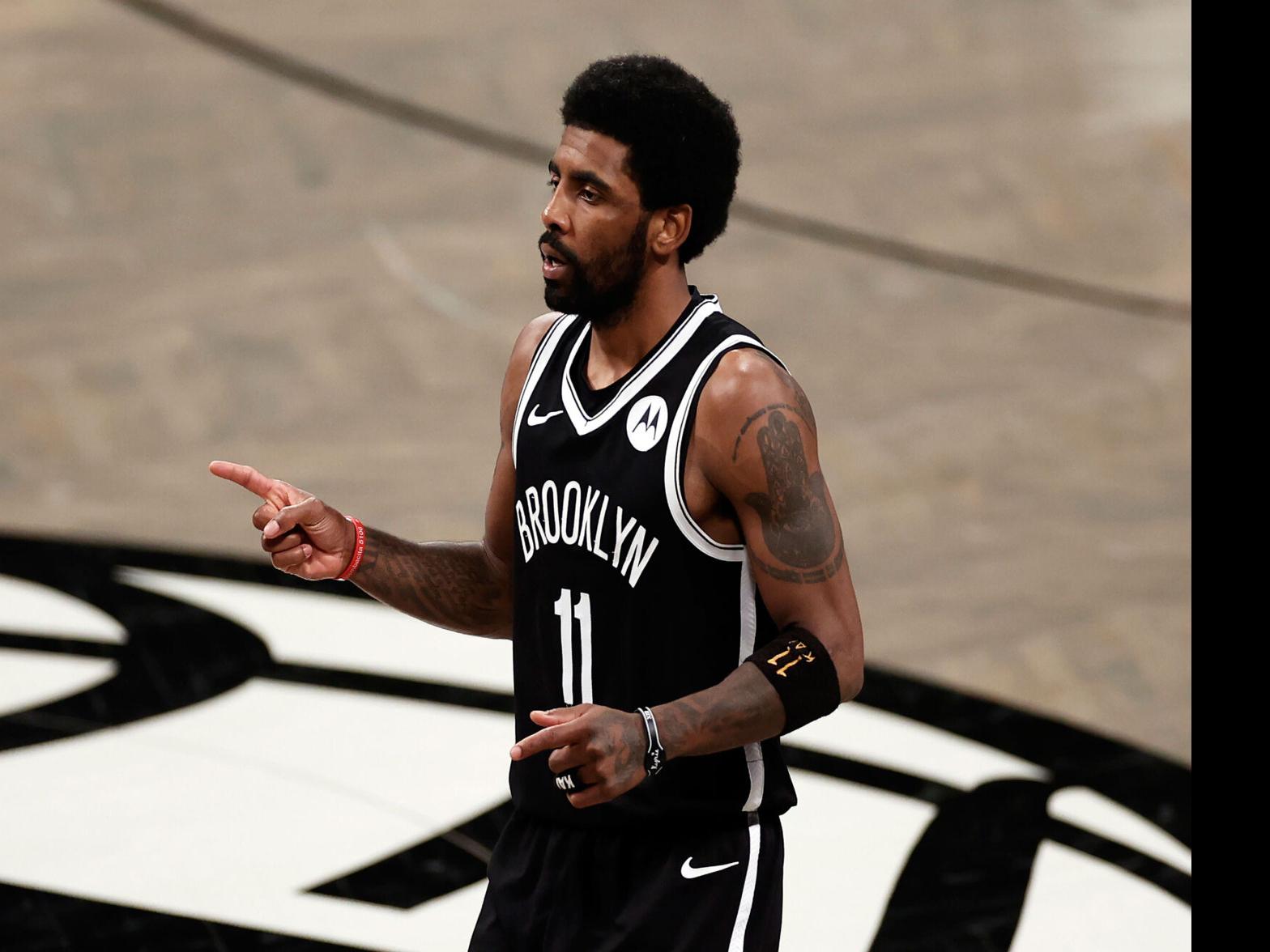 Don't you work here? Unvaccinated Nets star Kyrie Irving watches
