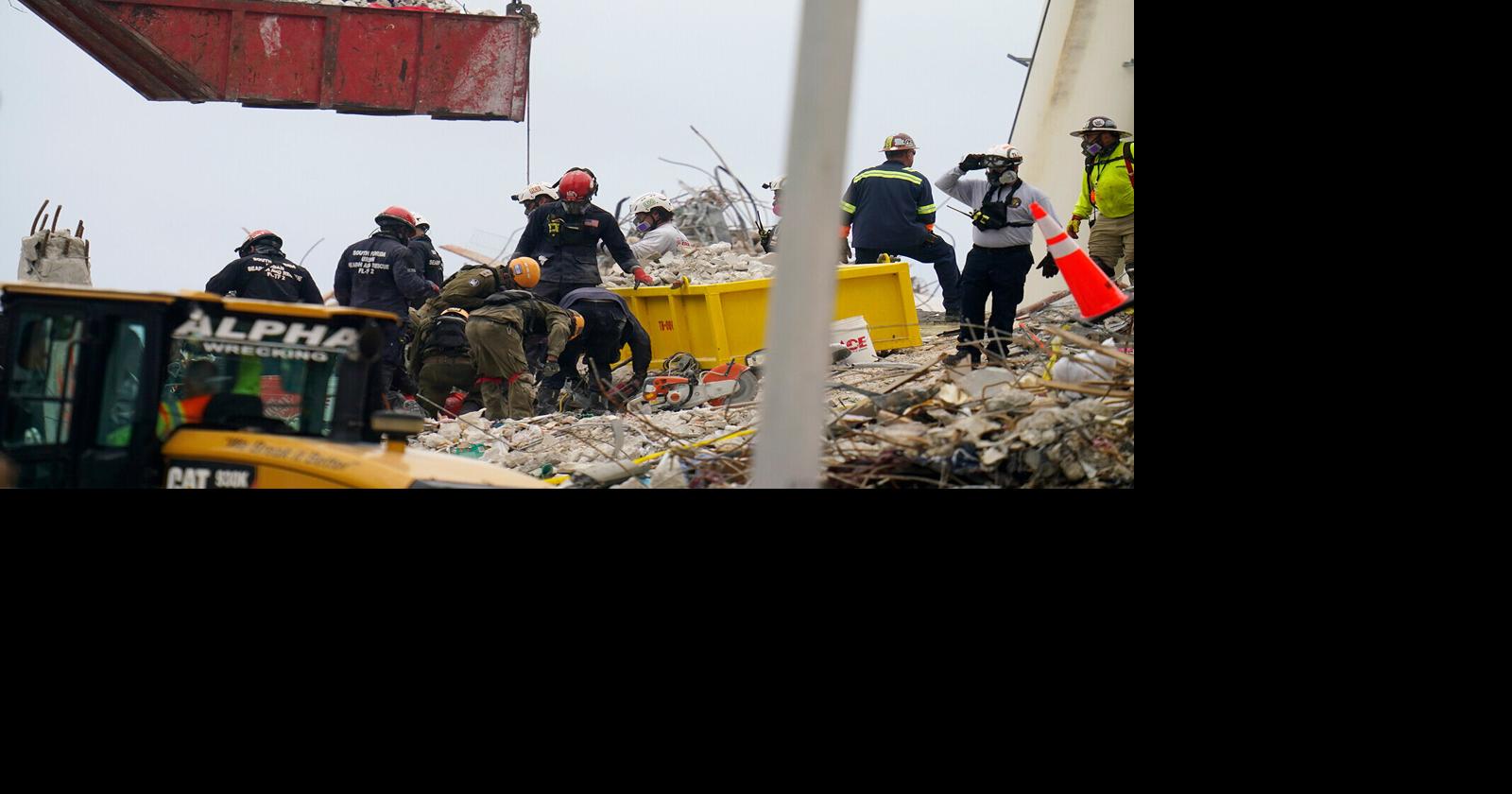 Rescue workers at Surfside building collapse find bodies of two ...