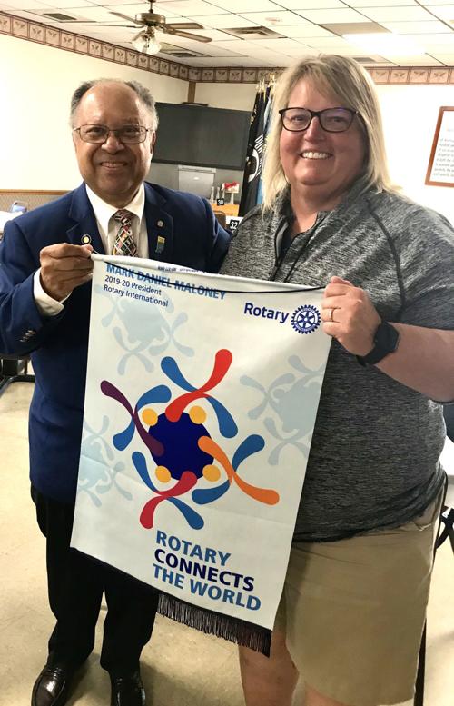 Area Rotary president receives banner