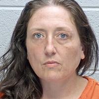 Woman charged with allegedly beating child in church parking lot