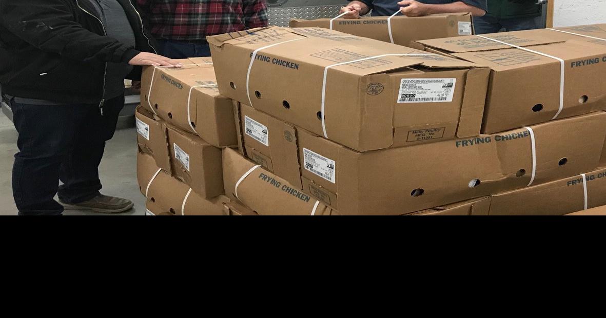Miller Poultry makes a holiday donation at Clothes and Food Basket of