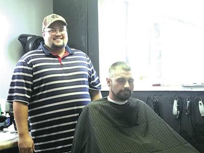 Albion barber cuts hair, supports children in community
