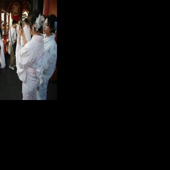 Chinese tourists wear kimonos as they visit the Sensoji Temple in the Asakusa district of Tokyo