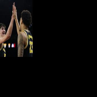 University of Michigan teammates Aday Mara and Yaxel Lendeborg react during the team's victory over the University of Arizona in the NCAA collegiate basketball touranment Final Four