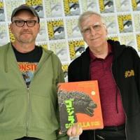 Authors Steve Ryfle (L) and Ed Godziszewski pose with a copy of their book about the first 70 years of the "Godzilla" franchise
