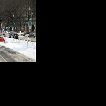 A snowplow works to clear snow on January 28, 2026 in Washington, DC