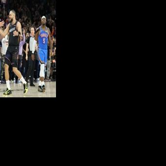 Devin Booker of the Phoenix Suns celebrates with Dillon Brooks after an NBA victory over the Oklahoma City Thunder