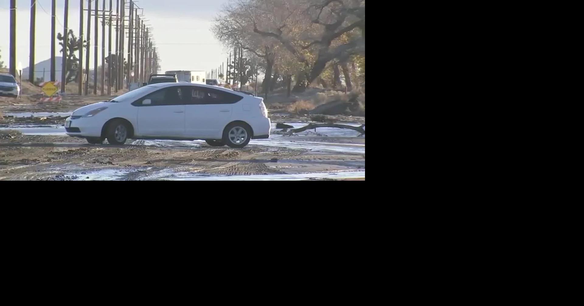 RAW: CA: FLOODED PALMDALE ROADWAY, CARS STUCK IN MUD