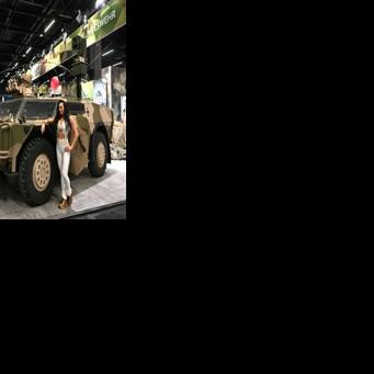 A parked Fennek armoured reconnaissance vehicle served as an attention-grabbing advertisement for the Bundeswehr's recruiting stand -- and a photo backdrop for visitors