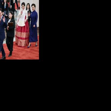 South Korea's President Lee Jae Myung (2nd L) and his wife Kim Hea Kyung (2nd R) wave with China's President Xi Jinping (L) and his wife Peng Liyuan (R) during a welcoming ceremony at the Great Hall of the People in Beijing on January 5, 2026