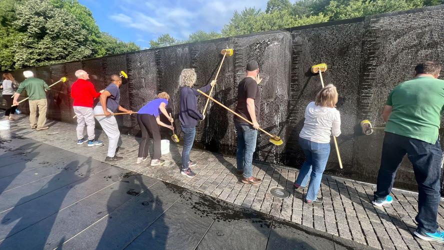 Bipartisan group of lawmakers clean Vietnam Veterans Memorial ahead of Memorial Day
