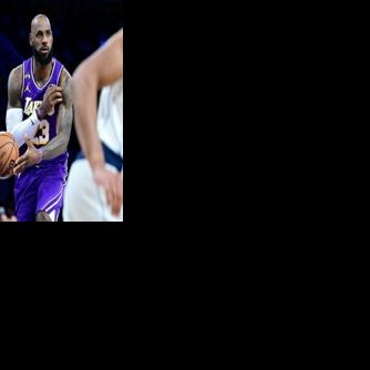 Los Angeles superstar LeBron James throws a no-look pass in the Lakers' NBA win over the Dallas Mavericks