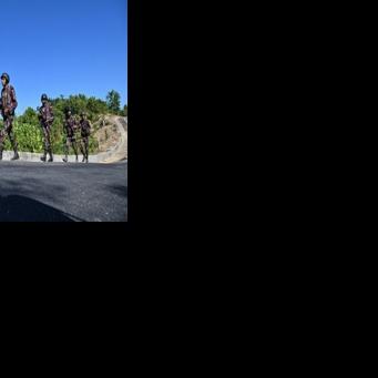 Border Guard Bangladesh (BGB) personnel patrol near the Bangladesh-Myanmar frontier in Bandarban district