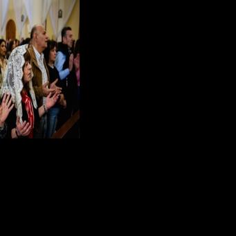 Hymns struggled to rise above the roar of Israeli fighter jets flying low over Beirut