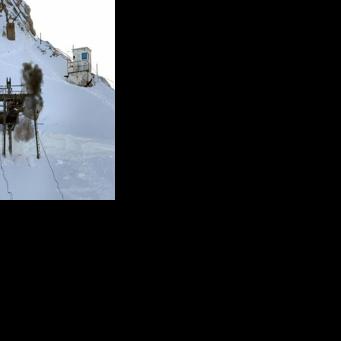 Explosives are set off at the Schneefernerkopf ski lift to start its demolition at the Zugspitze ski resort near Garmisch-Partenkirchen, southern Germany