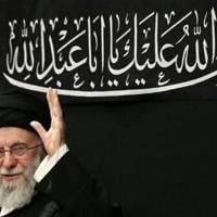 Iran's supreme leader Ayatollah Ali Khamenei waves to the audience in this handout picture released by his office