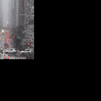 Pedestrians and cars move along 42nd Street in the Manhattan borough of New York City