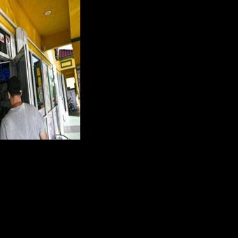 A man enters a Venezuelan food mart in Doral, Florida, where 40 percent of the population is of Venezuelan origin