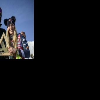 Lindsey Vonn poses with her coach and former Norwegian skier Aksel Lund Svindalin St. Moritz