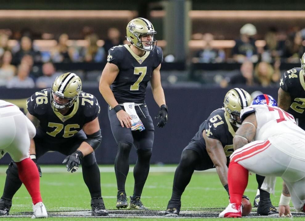 New Orleans Saints quarterback Taysom Hill (7) walks off the field