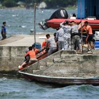 The Philippine Coast Guard took part in search operations on Lake Taal, which spans more than 230 squar kilometres (89 square miles)
