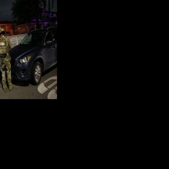 An FBI tactical team prepares to enter a house associated with the suspected White House Correspondents' Dinner shooter in Torrance, California, on April 25, 2026