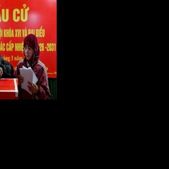 Ethnic minority citizens cast their votes inside a polling station in the northern Vietnamese province of Tuyen Quang