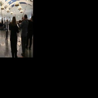 Musicians from the Kyiv-Classic orchestra take the applause after a concert at the Ukrainian capital's central train station in a bid to "warm souls"