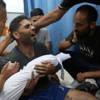 A Palestinian man mourns his 6-month-old son, killed in a reported Israeli strike on Gaza City