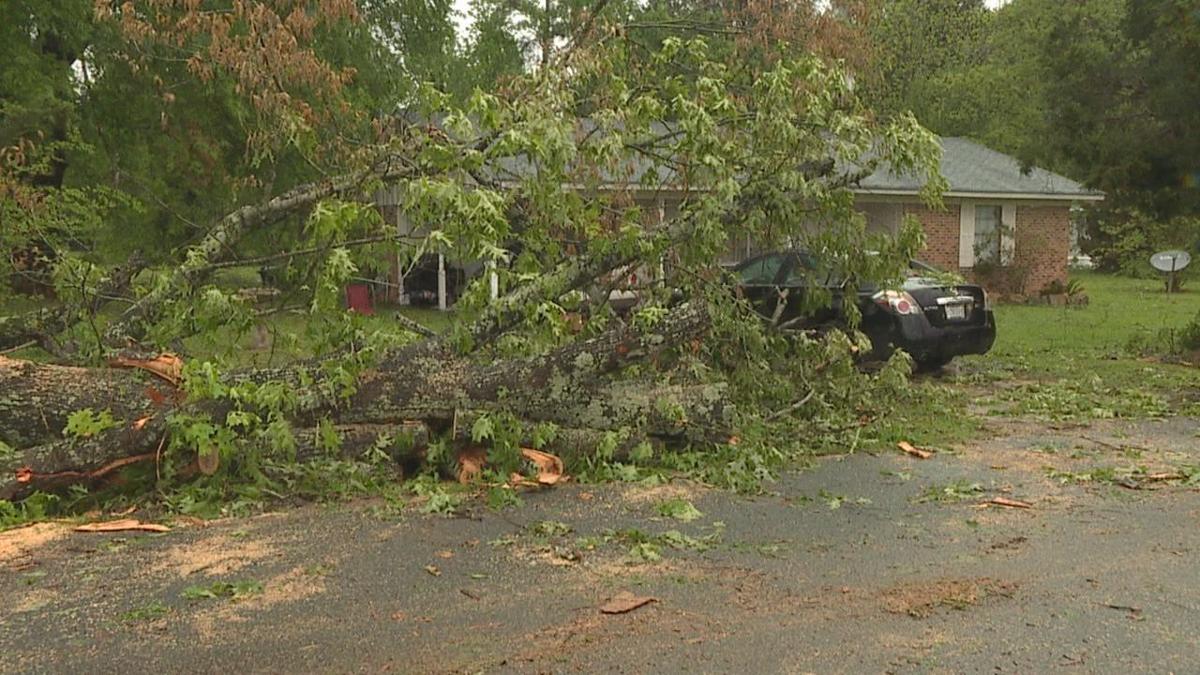 People in Coushatta cleanup debris after a severe storm Severe