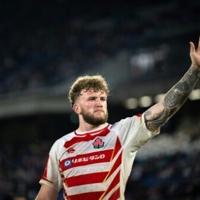 Japan captain Warner Dearns scored a try to help his squad to a 62-24 rout of Tonga in a semi-final match of the Pacific Nations Cup men's rugby tournament
