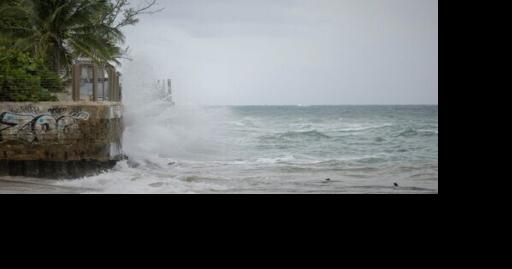 Downgraded Hurricane Erin lashes Caribbean with rain