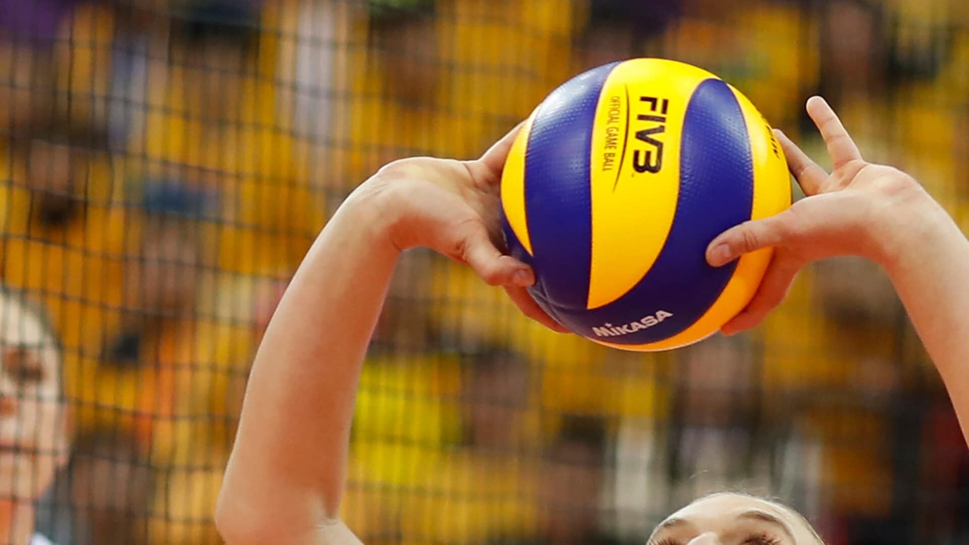 A volleyball player makes contact with the ball | Olympics | wktv.com