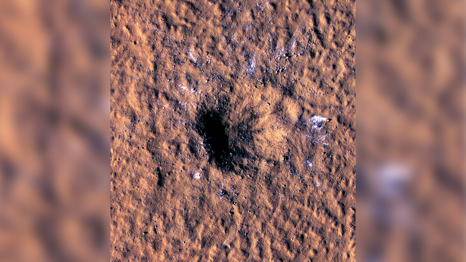 Space rock slams into Mars, forming a crater that revealed chunks