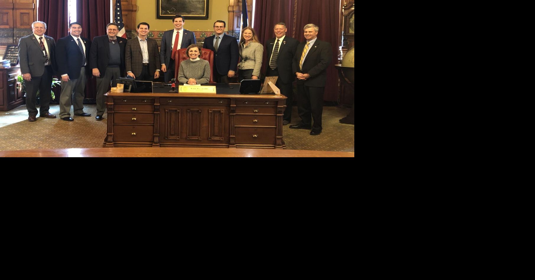 Reynolds signs bill to increase Iowa's school funding by 2.5, gives