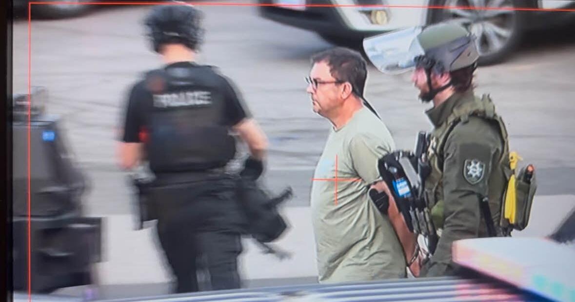 Former Spokane city councilman booked into jail following protest at ICE building